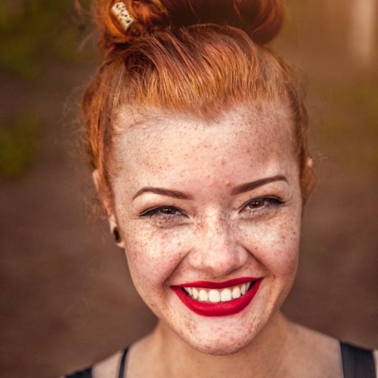 Avery Chen, Lead Design Curator at SignalGardenPath, reviewing corporate floral arrangements